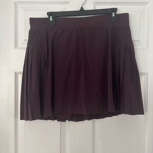 SPANX Get Moving Skirt Pleated Skirt with Shorts & Pocket. Color Plum - Size 1X
